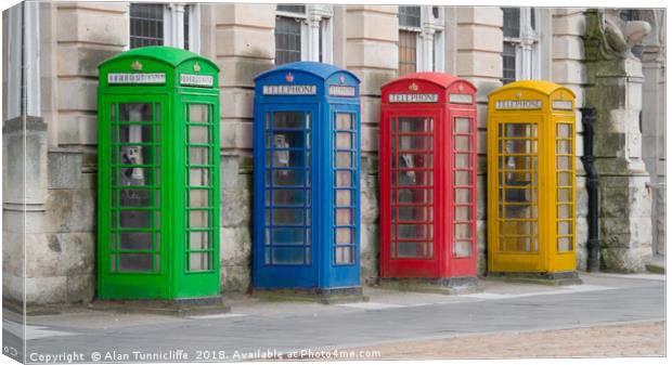 Colourful telephone boxes Canvas Print by Alan Tunnicliffe