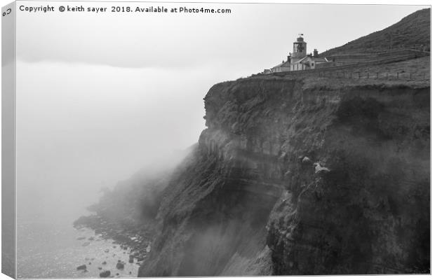 Whitby Lighthouse as the fog rolls in Canvas Print by keith sayer