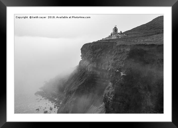 Whitby Lighthouse as the fog rolls in Framed Mounted Print by keith sayer