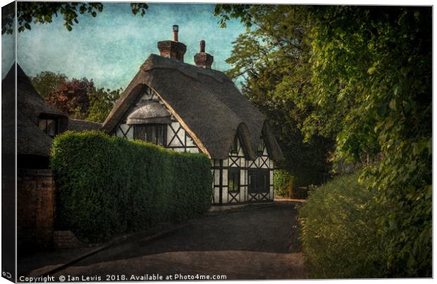 Enchanting Sulham Thatched Cottage Canvas Print by Ian Lewis