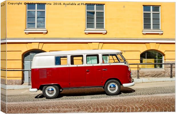 Camper Van Parked By A Yellow Building Canvas Print by Jukka Heinovirta