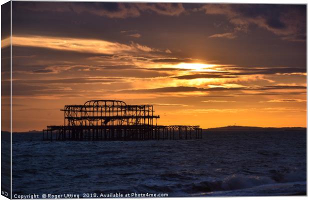 West Pier at sunset Canvas Print by Roger Utting