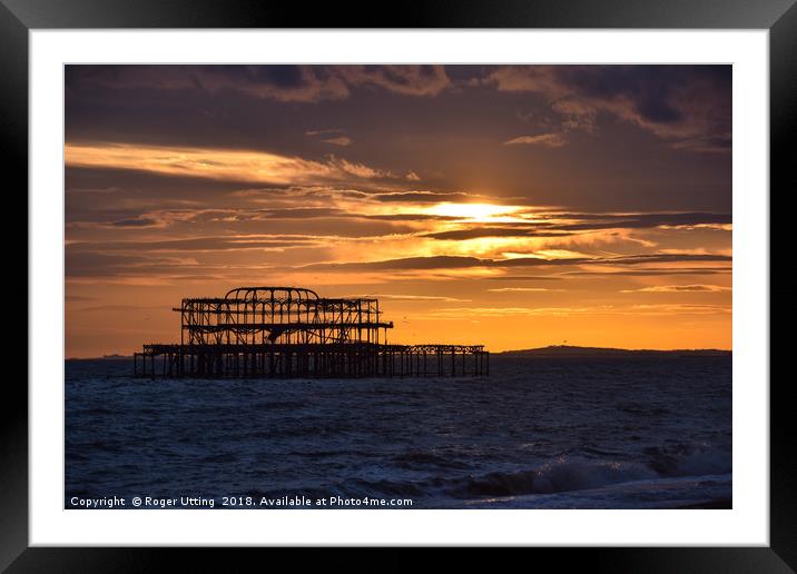 West Pier at sunset Framed Mounted Print by Roger Utting