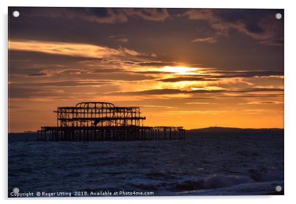 West Pier at sunset Acrylic by Roger Utting