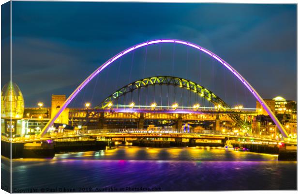 Newcastle Bridges At Night  Canvas Print by Paul Gibson