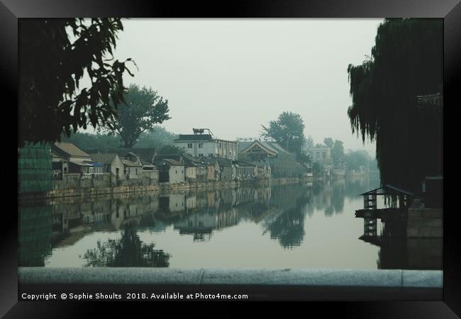 Hutongs through the smog in Beijing Framed Print by Sophie Shoults