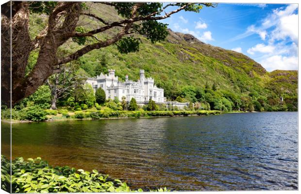 Kylemore Abbey in Connemara mountains with lake in Canvas Print by Thomas Baker
