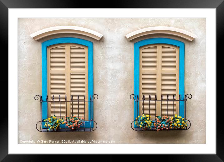 Two quaint windows, with bright blue frames Framed Mounted Print by Gary Parker