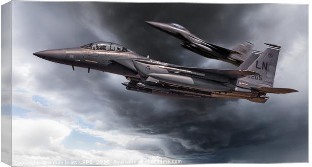 Two fighter jets close up in storm clouds Canvas Print by Simon Bratt LRPS