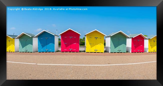 Colorful wooden beach huts in Eastbourne Framed Print by Beata Aldridge