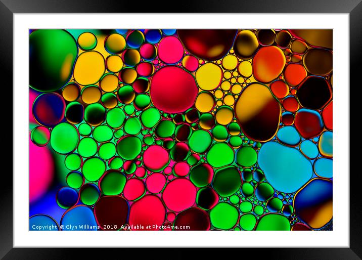 Oil drops on water. Framed Mounted Print by Glyn Williams
