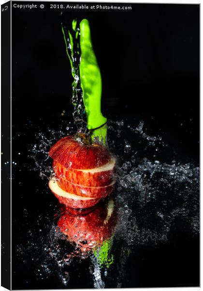 Fresh Apple slices drenched with water Canvas Print by Jonny Essex