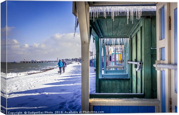 Icicles through the Beach Huts on a Winters day Canvas Print by GadgetGaz Photo