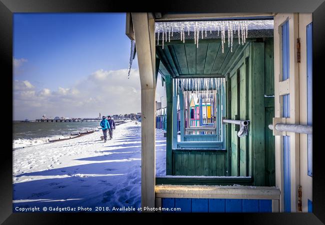 Icicles through the Beach Huts on a Winters day Framed Print by GadgetGaz Photo