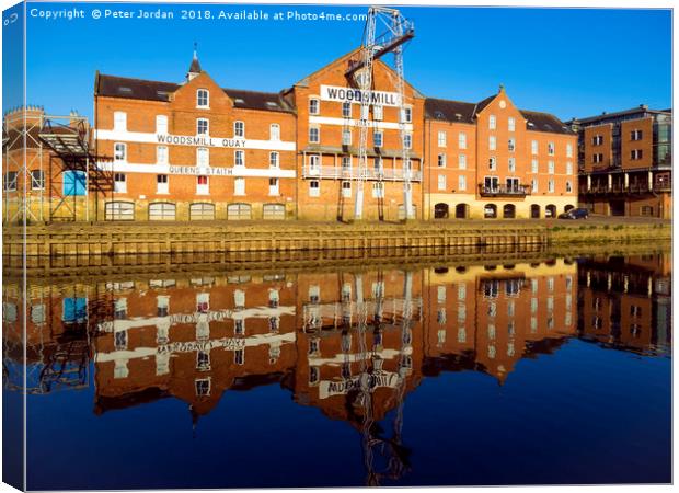 Historic buildings on Woodsmill Quay Queen's Stait Canvas Print by Peter Jordan