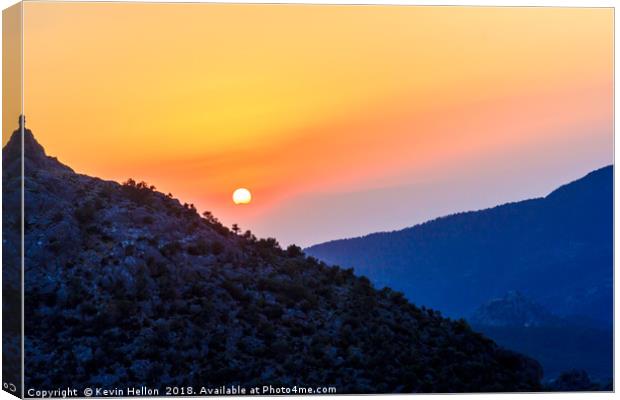 Sunset over the mountains  Canvas Print by Kevin Hellon