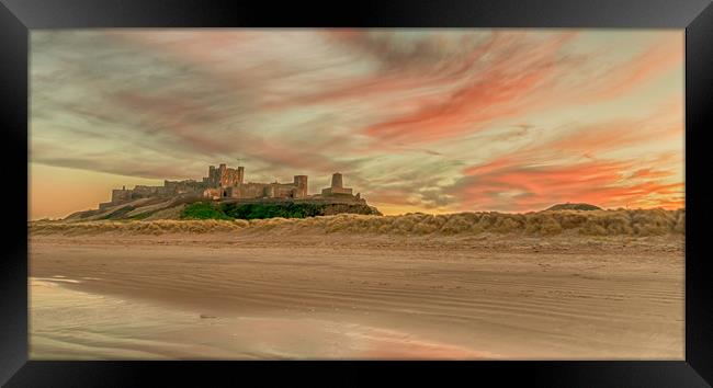 Bamburgh Castle fiery Sunset Framed Print by Naylor's Photography