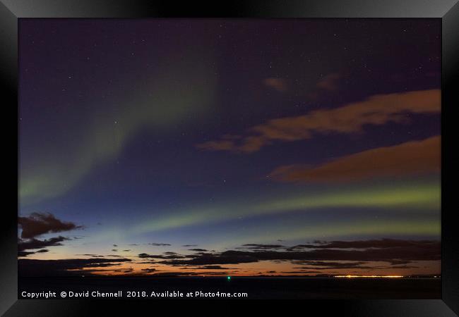 Aurora Over Reykjavik Framed Print by David Chennell