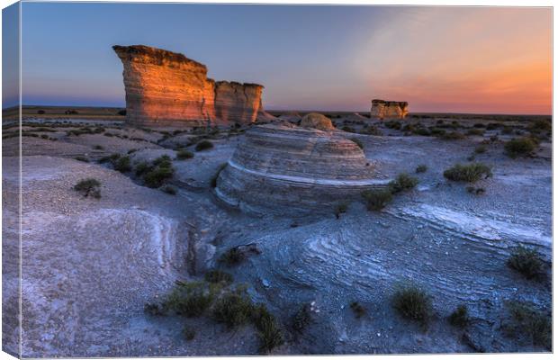 Monument Rocks. sunset in the desert Canvas Print by John Finney