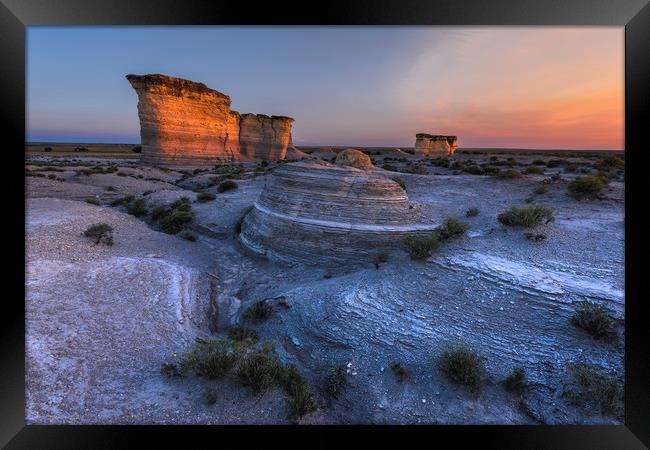 Monument Rocks. sunset in the desert Framed Print by John Finney