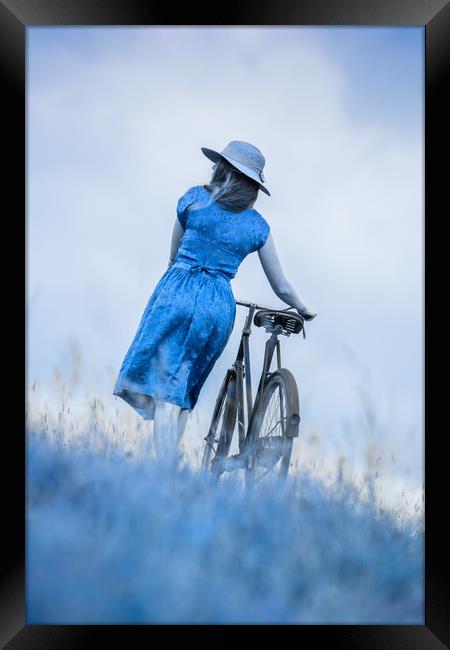 woman with bicycle in field Framed Print by Maggie McCall