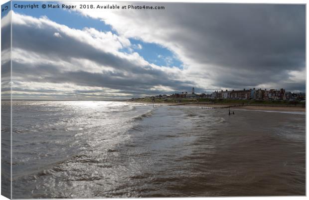 Southwold Seafront with Contrasting Sun and Clouds Canvas Print by Mark Roper