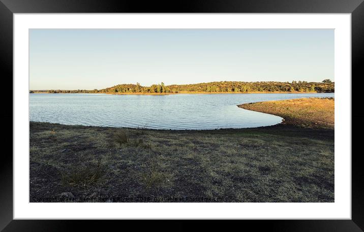 Sunny lake with eucalyptus mountain in the backgro Framed Mounted Print by Juan Ramón Ramos Rivero
