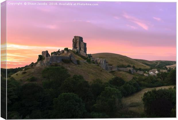 Sunset over Corfe Castle  Canvas Print by Shaun Jacobs