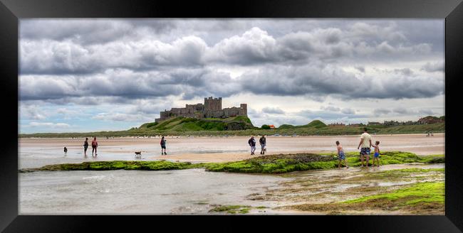 Storm clouds over Bamburgh Castle - Panororama Framed Print by Philip Brown