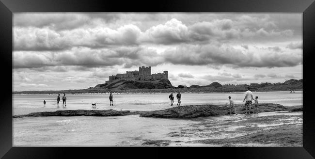 Storm clouds over Bamburgh Castle - Panororama Framed Print by Philip Brown