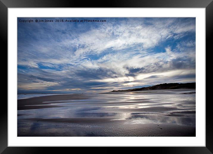 Cloudy blue sky reflected in the wet sand at Druri Framed Mounted Print by Jim Jones