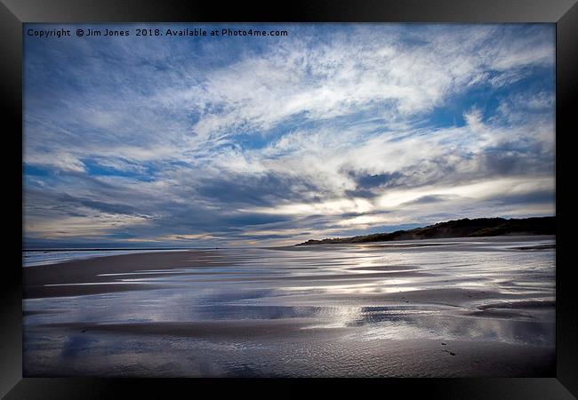 Cloudy blue sky reflected in the wet sand at Druri Framed Print by Jim Jones
