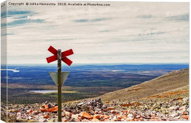 Cross On Top Of The Mountain Canvas Print by Jukka Heinovirta