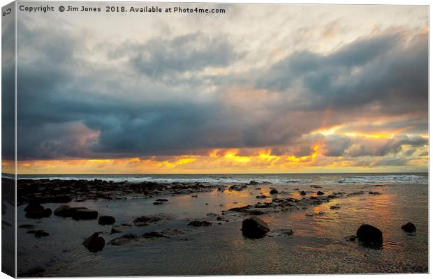 Sunrise over a tranquil North Sea Canvas Print by Jim Jones