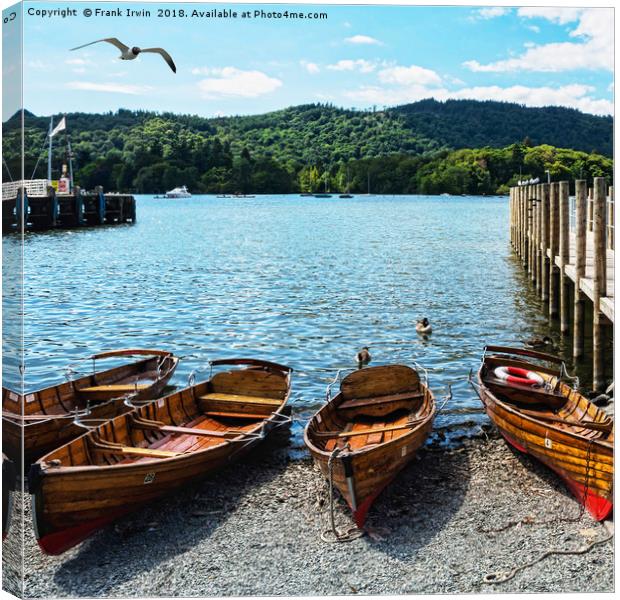 Rowing boats moored on Windermere. Canvas Print by Frank Irwin