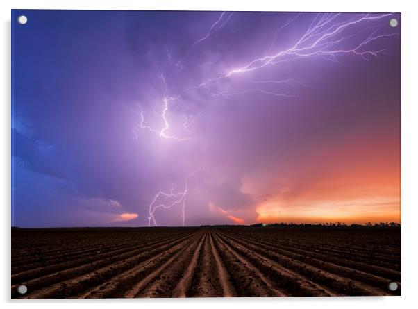 Lightning crawler over a ploughed field at sunset Acrylic by John Finney