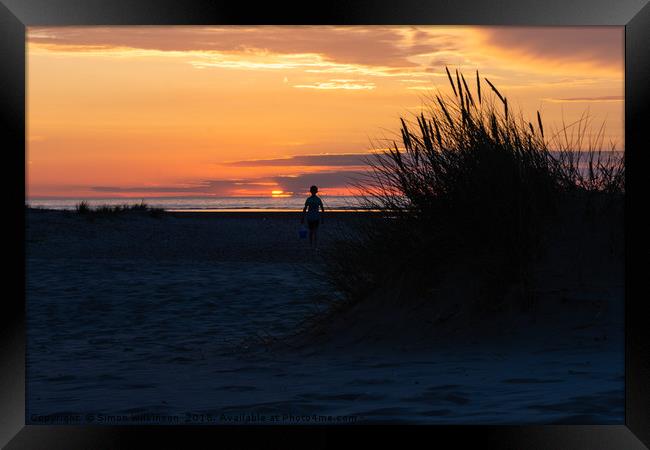 Lone Boy at sunset Framed Print by Simon Wilkinson