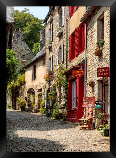 Cobbled street in Dinan Brittany France Framed Print by Susan Moss