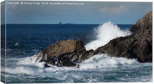 Waves crash against jagged rocks at Malin Head  Canvas Print by Ciaran Craig