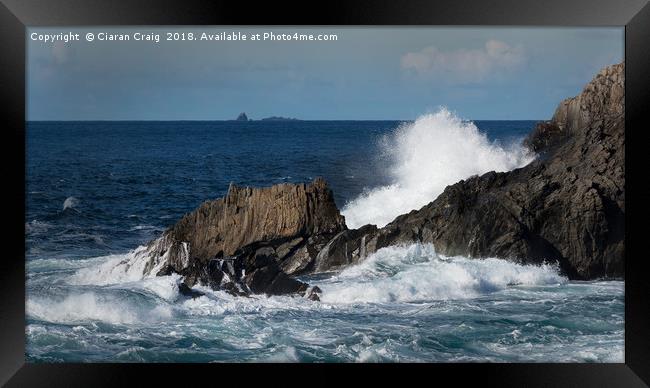 Waves crash against jagged rocks at Malin Head  Framed Print by Ciaran Craig