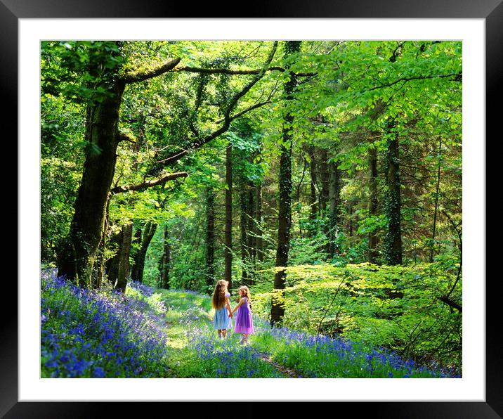 Little girls in Bluebell wood Framed Mounted Print by Maggie McCall
