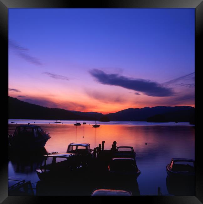 Boat Jetty  at sunset on  Windermere, Cumbria, UK Framed Print by Maggie McCall