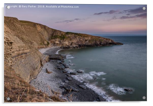 Pebble beach and cliffs at sunset Acrylic by Gary Parker