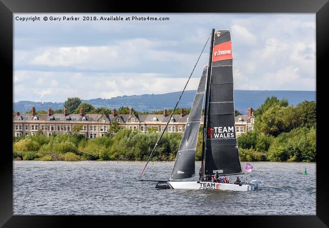 A Team Wales catamaran sails in Cardiff Bay, Wales Framed Print by Gary Parker