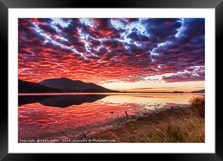 Sun reflecting on clouds at sunrise Framed Mounted Print by Kevin Hellon