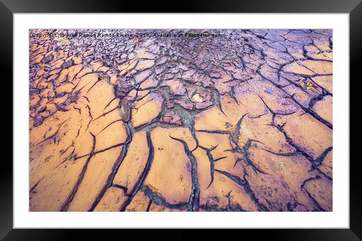 Dry and cracked ground texture of yellow and purpl Framed Mounted Print by Juan Ramón Ramos Rivero