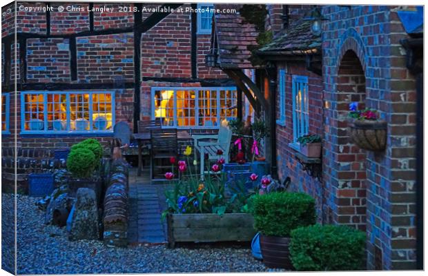 Evening in the courtyard Canvas Print by Chris Langley
