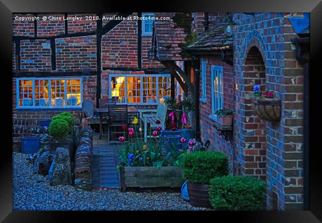 Evening in the courtyard Framed Print by Chris Langley