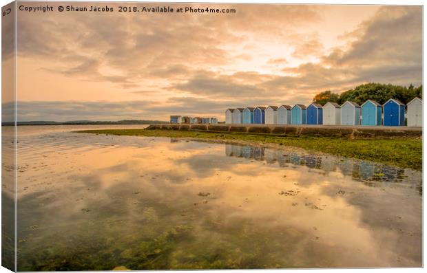 Beach huts reflections  Canvas Print by Shaun Jacobs