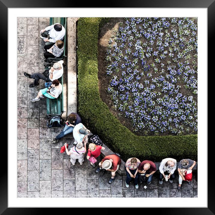 People rest on the benches Framed Mounted Print by Sergio Delle Vedove